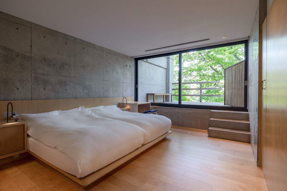 Primary guest room at Beniya Mukayu — full-room view, natural lighting, clear sightlines, PressBeyond standard