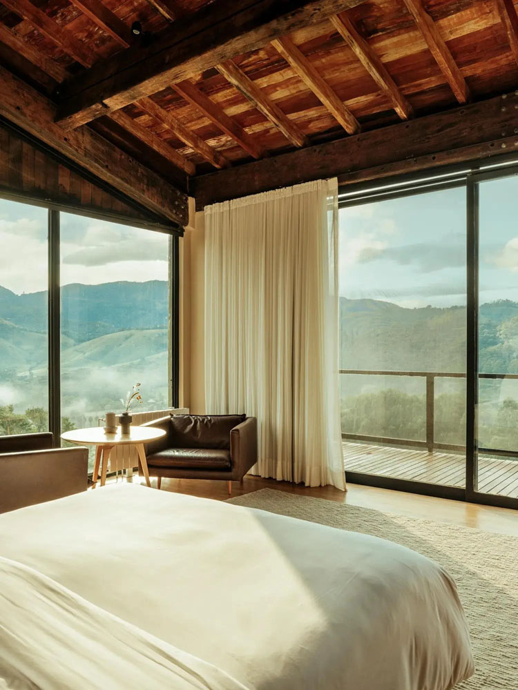 Primary guest room at Botanique Hotel Experience — full-room view, natural lighting, clear sightlines, PressBeyond standard