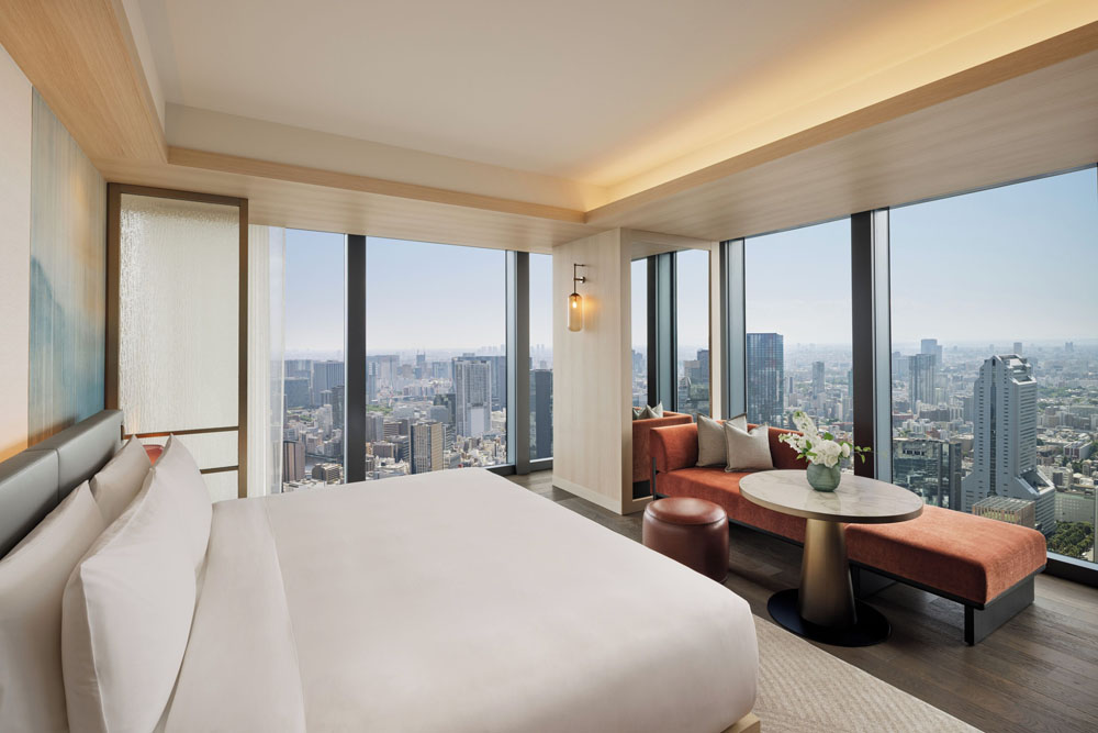 Primary guest room at Fairmont Tokyo — full-room view, natural lighting, clear sightlines, PressBeyond standard