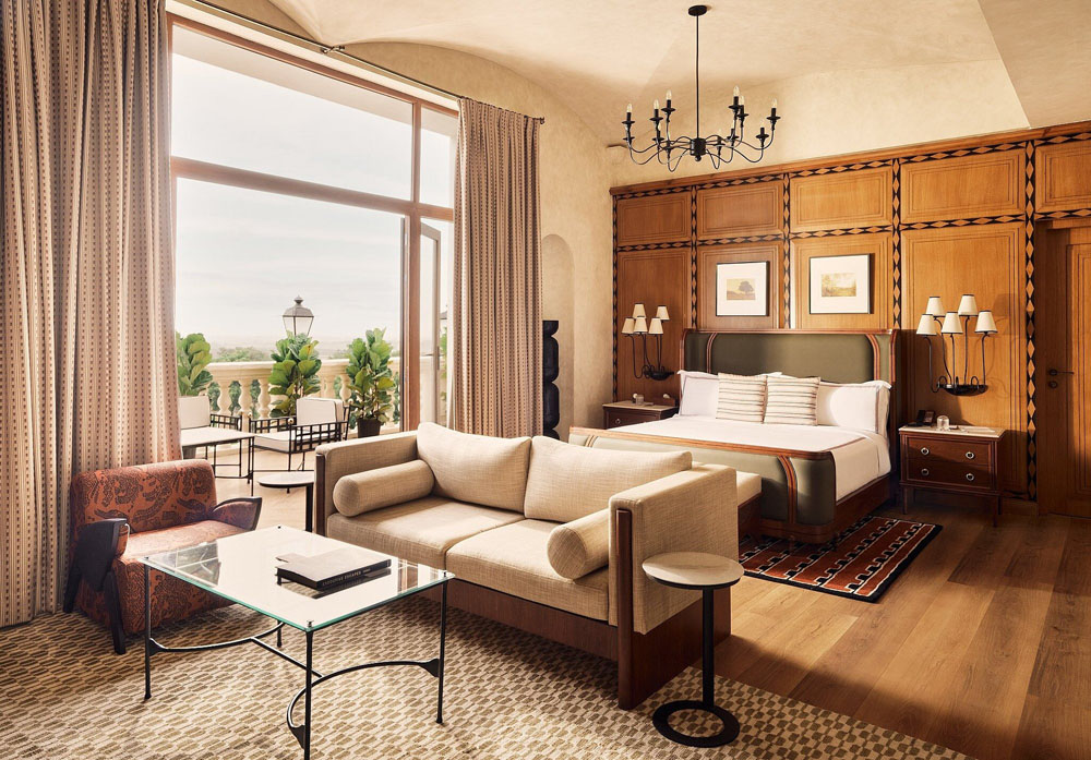 Primary guest room at Hotel Irada — full-room view, natural lighting, clear sightlines, PressBeyond standard