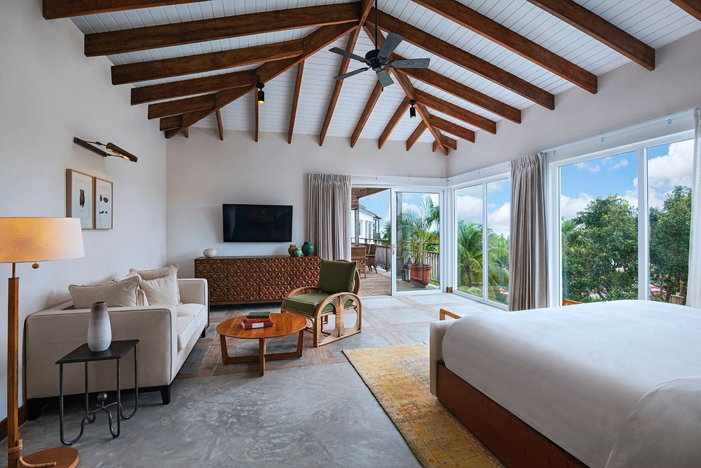 Secondary guest room at Itz'ana Belize Resort & Residences — distinct layout from primary bedroom, PressBeyond hotel image sequence