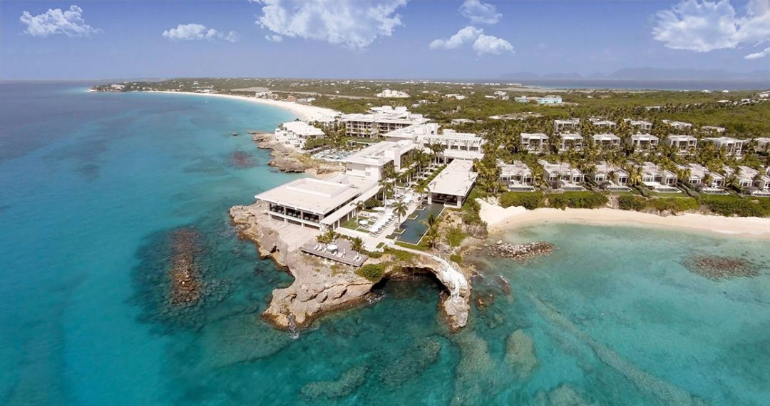 Exterior view of Four Seasons Resort and Residences Anguilla — full building facade, street-level angle, PressBeyond hotel series