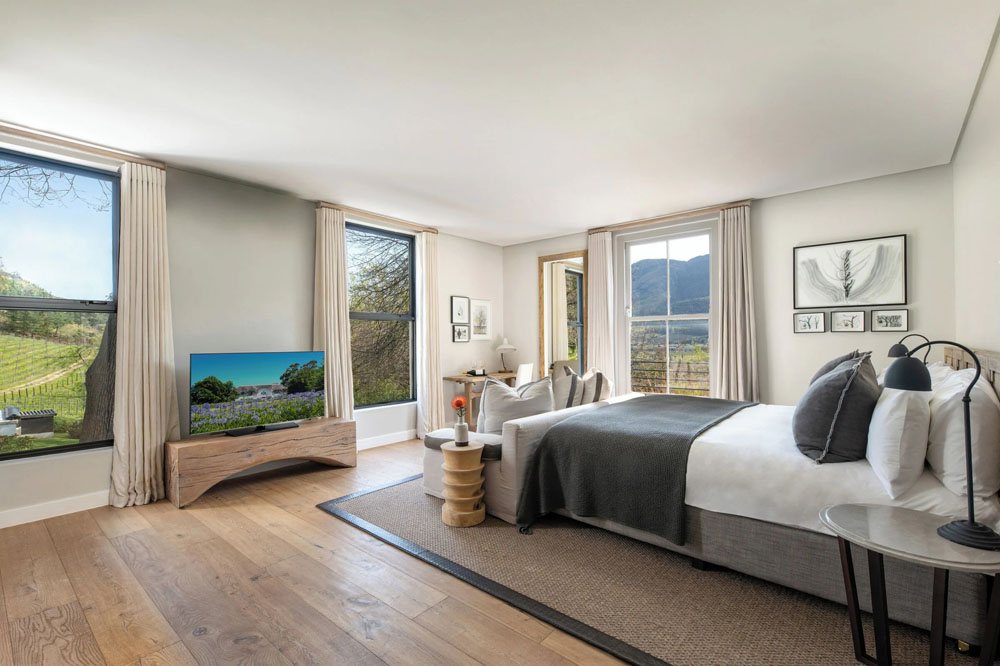 Secondary guest room at Mont Rochelle — distinct layout from primary bedroom, PressBeyond hotel image sequence