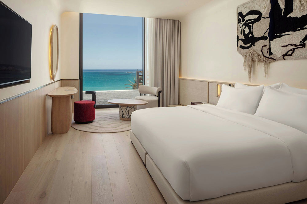 Secondary guest room at Morea House, Autograph Collection — distinct layout from primary bedroom, PressBeyond hotel image sequence