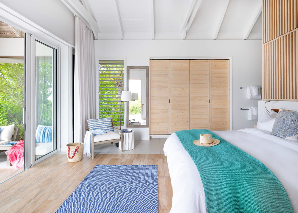 Secondary guest room at Pine Cay — distinct layout from primary bedroom, PressBeyond hotel image sequence
