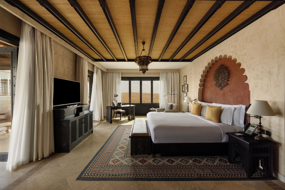Secondary guest room at Qasr Al Sarab Desert Resort By Anantara — distinct layout from primary bedroom, PressBeyond hotel image sequence