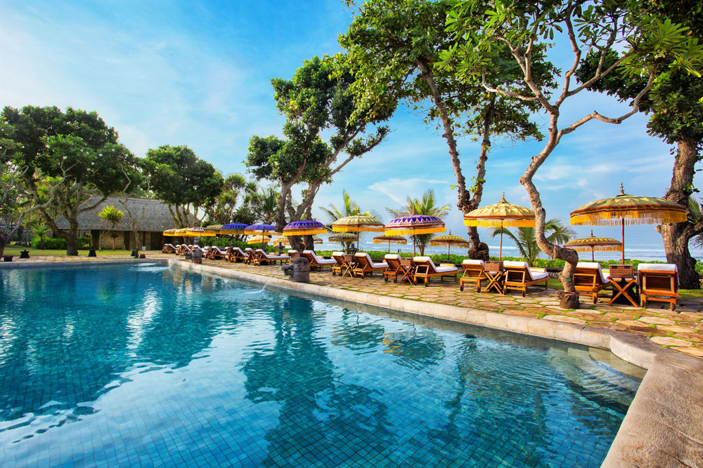 Lounge and social space at The Oberoi Beach Resort, Bali — distinct bar, dining, or terrace area, PressBeyond hotel series