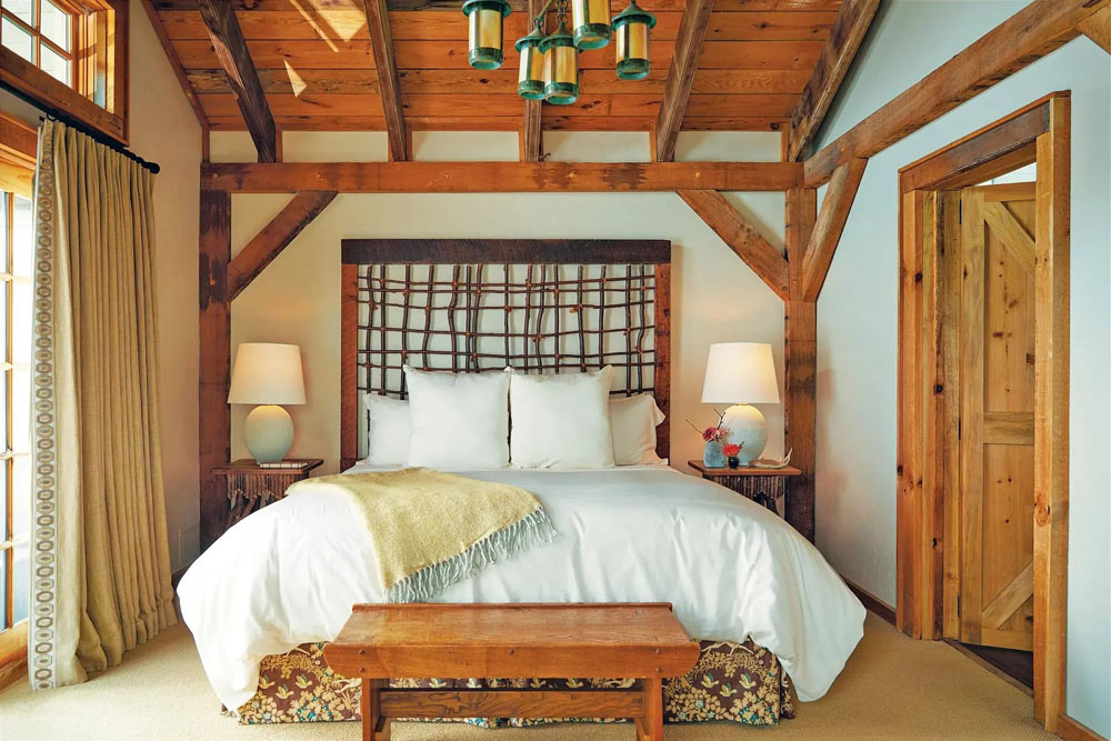Primary guest room at The Swag — full-room view, natural lighting, clear sightlines, PressBeyond standard