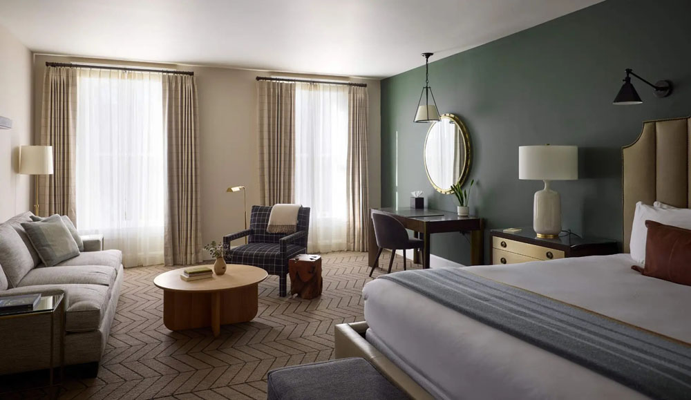 Secondary guest room at Tributary Hotel — distinct layout from primary bedroom, PressBeyond hotel image sequence