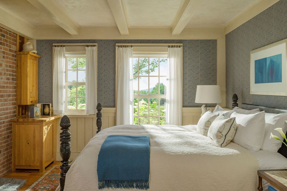 Secondary guest room at Twin Farms — distinct layout from primary bedroom, PressBeyond hotel image sequence