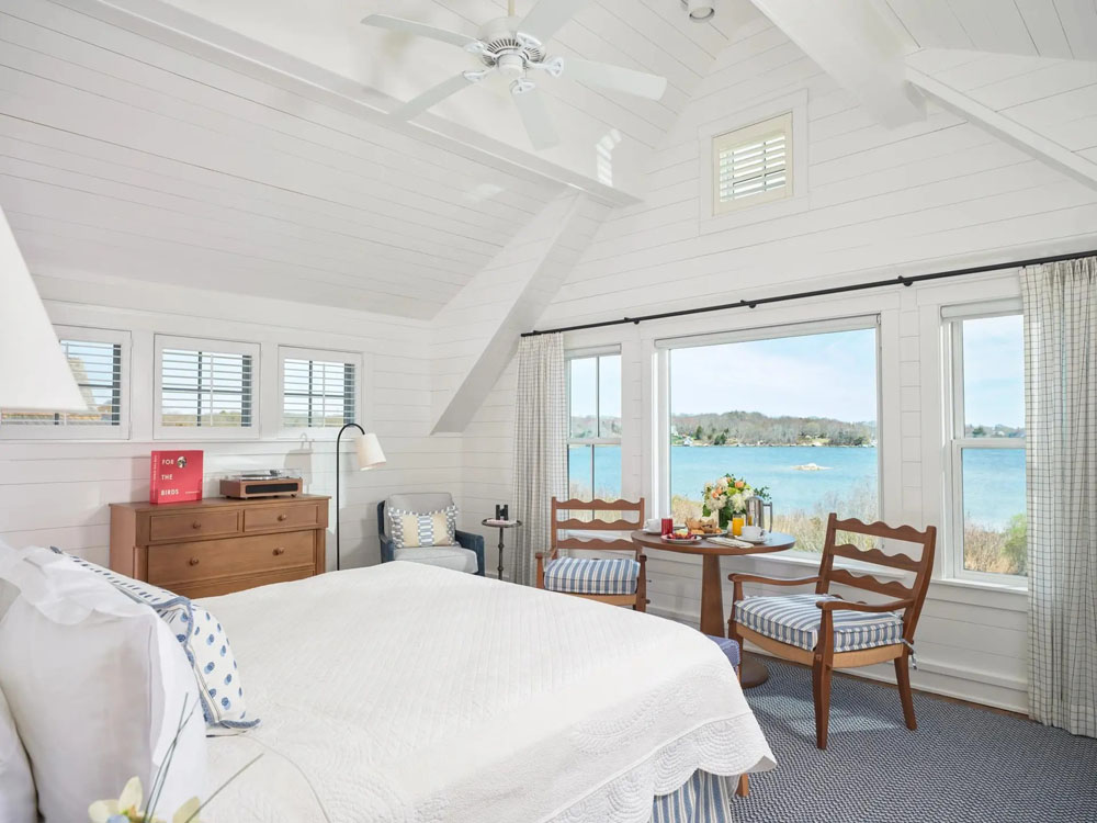 Primary guest room at Weekapaug Inn — full-room view, natural lighting, clear sightlines, PressBeyond standard